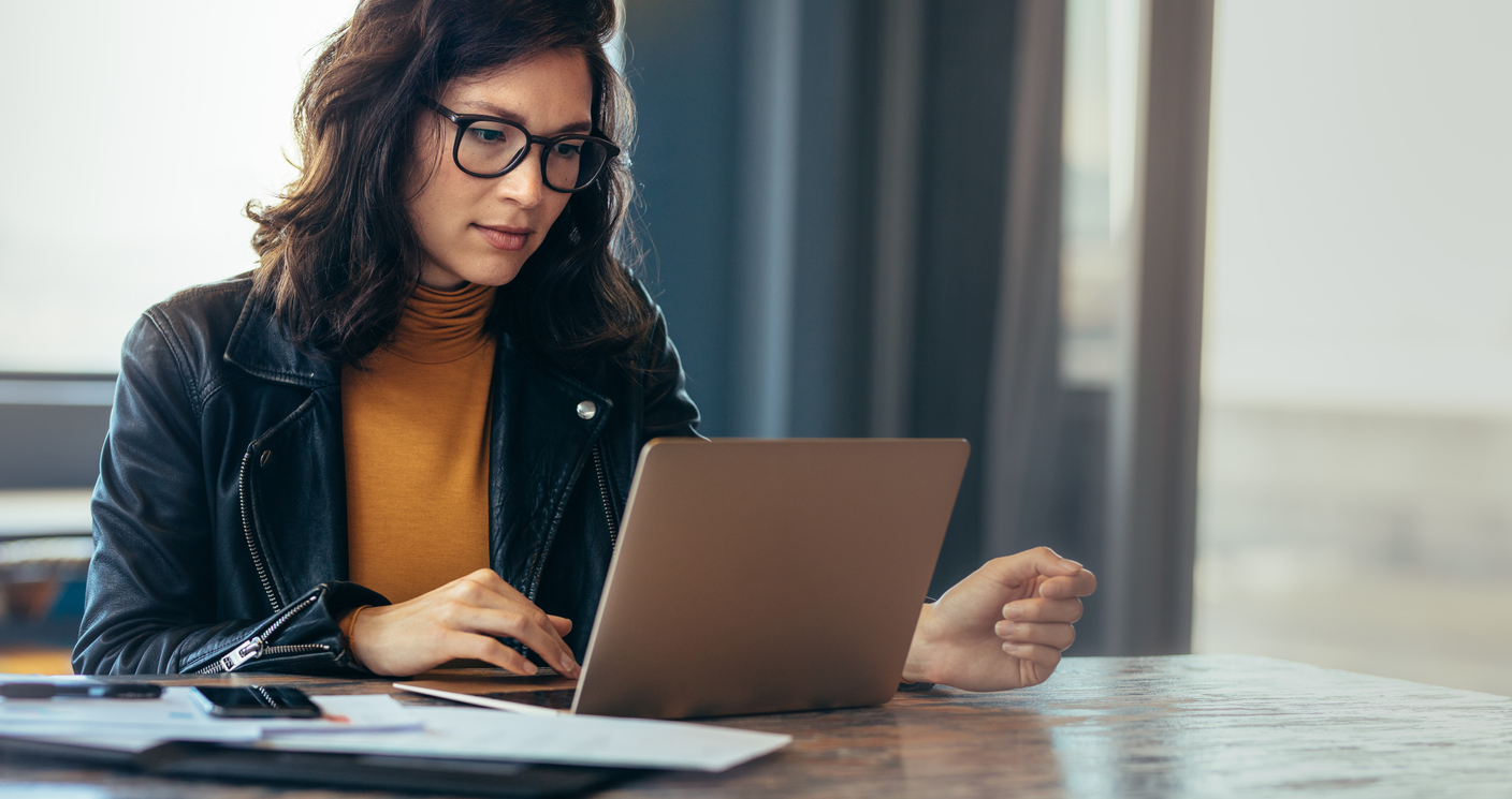 Woman reading about how to send a test email in Klaviyo