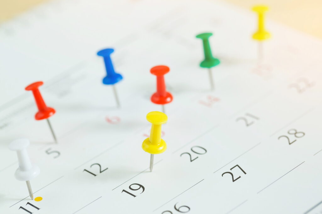 Calendar with thumbtacks