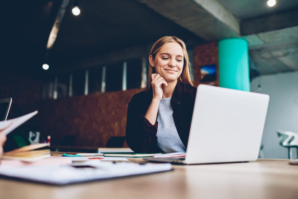 A woman reading about email segmentation.