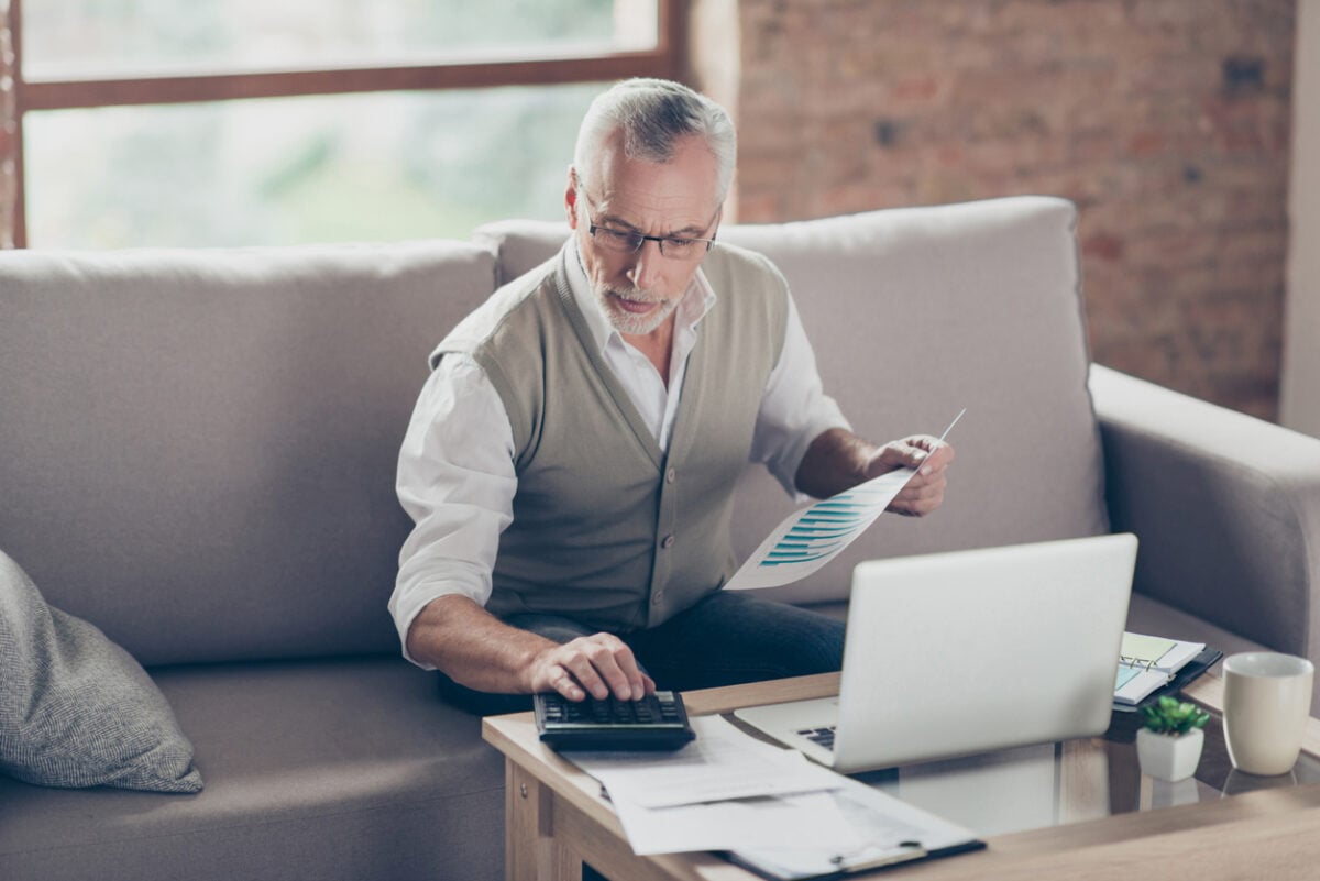 Man calculating his email campaign response rates